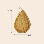 Teardrop-shaped jute product with measurements on a beige background
